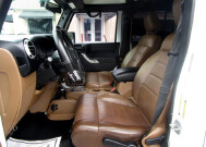 2012 Jeep Wrangler in Tampa, FL 33604-6914 - 1995919 36